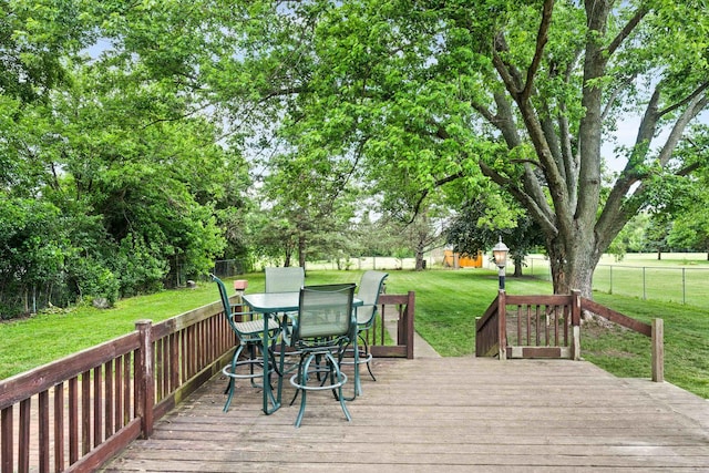 1106 Countryside Ln, Pontiac, IL 61764 - wooden terrace with view of scattered trees, outdoor dining area, and an outbuilding