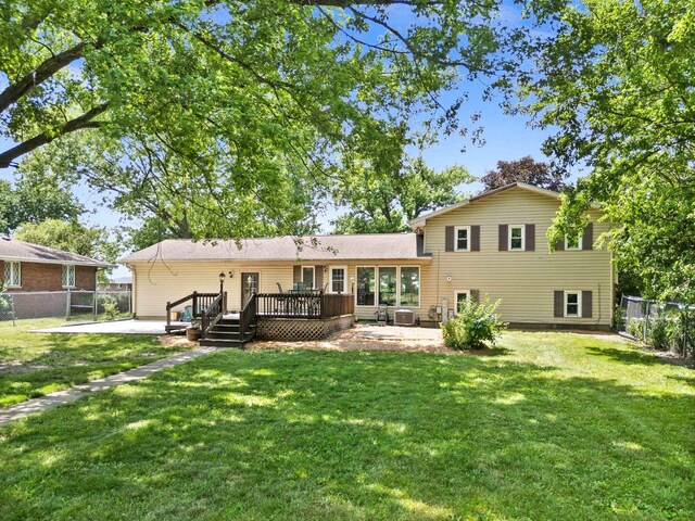 1106 Countryside Ln, Pontiac, IL 61764 - rear view of house featuring a patio area, a fenced backyard, and a deck