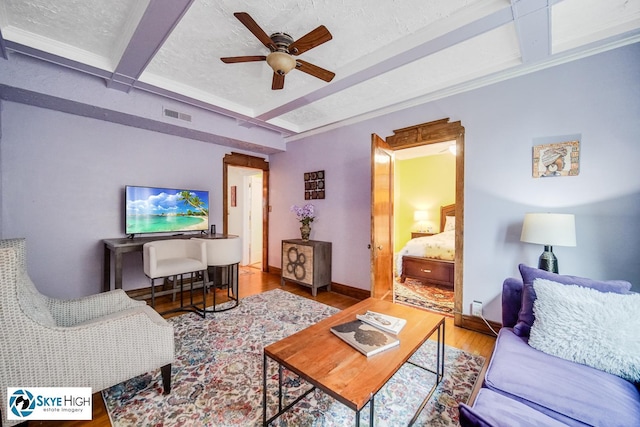 945 E Hyde Park Blvd Unit 2, Chicago, IL 60615 - living room with a ceiling fan, wood finished floors, and beamed ceiling