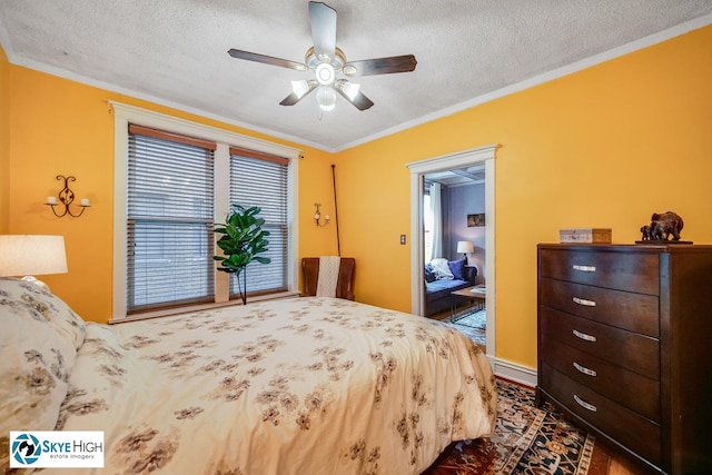 945 E Hyde Park Blvd Unit 2, Chicago, IL 60615 - bedroom with ornamental molding, a textured ceiling, and a ceiling fan