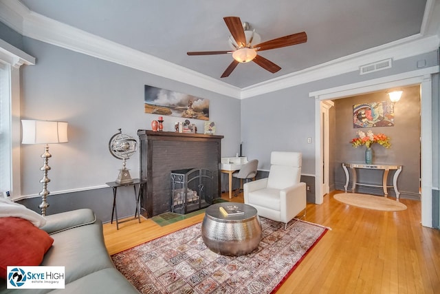 945 E Hyde Park Blvd Unit 2, Chicago, IL 60615 - living area featuring ceiling fan, wood finished floors, ornamental molding, and a fireplace