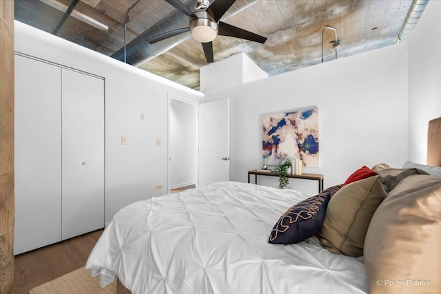 1550 S Blue Island Ave Unit 822, Chicago, IL 60608 - bedroom with wood finished floors, a closet, and ceiling fan
