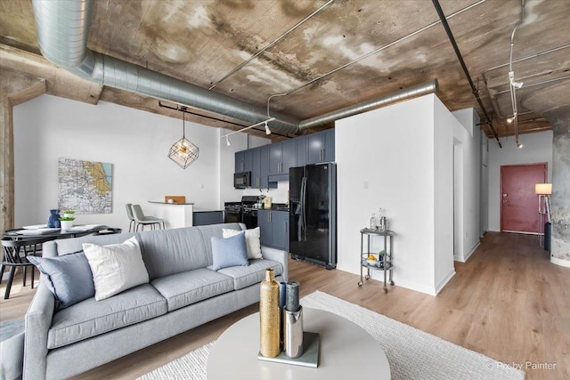 1550 S Blue Island Ave Unit 822, Chicago, IL 60608 - living room featuring light wood finished floors and baseboards