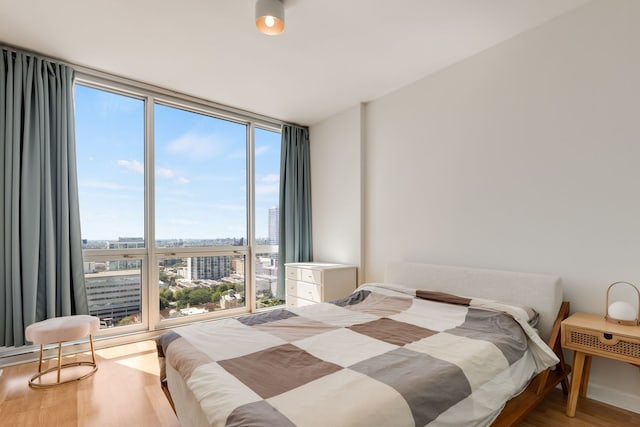 1901 S Calumet Ave Unit 2010, Chicago, IL 60616 - bedroom with expansive windows, wood finished floors, and a city view