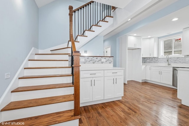 629 E 87th Pl, Chicago, IL 60619 - stairs with wood finished floors and recessed lighting
