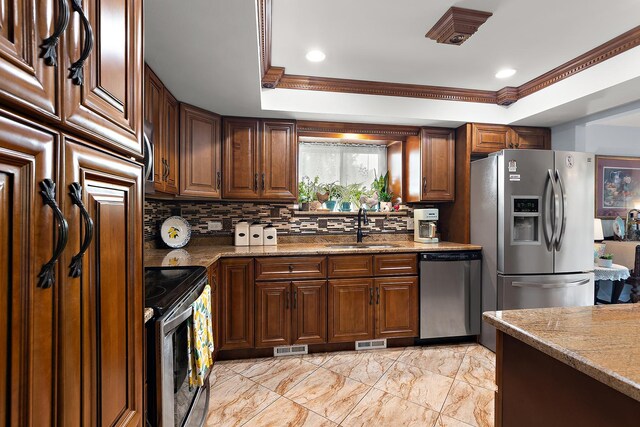 11138 Center Rd Unit E22, Palos Hills, IL 60465 - kitchen with appliances with stainless steel finishes, decorative backsplash, ornamental molding, a tray ceiling, and light marble finish floors