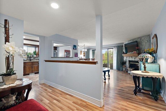 11138 Center Rd Unit E22, Palos Hills, IL 60465 - living room with light wood-style floors and a fireplace