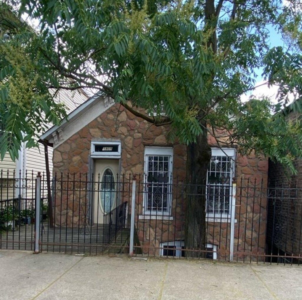 1809 W 21st St, Chicago, IL 60608 - view of front of house with stone siding and a gate