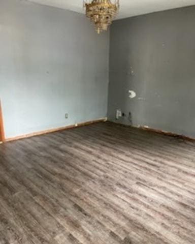 1809 W 21st St, Chicago, IL 60608 - spare room with wood finished floors and a chandelier