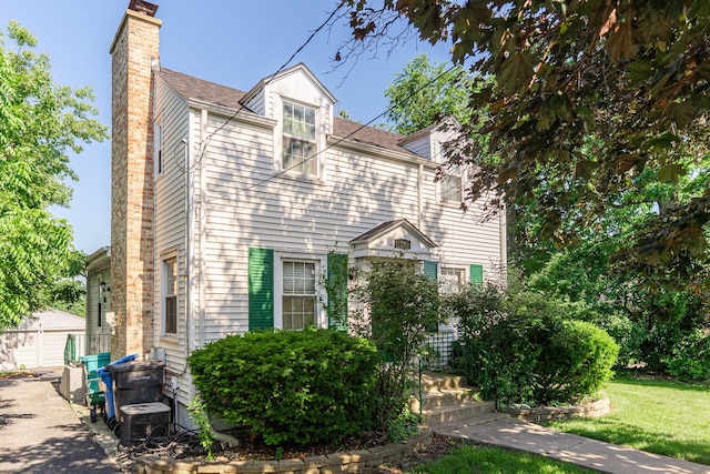 29 Oak Ridge Ave, Hillside, IL 60162 - view of front of property with a chimney and a front yard