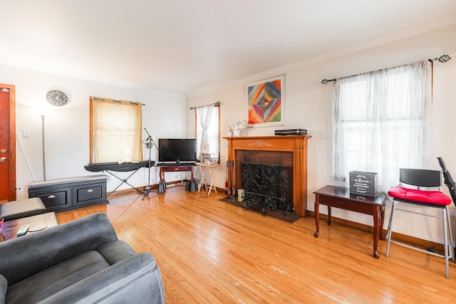29 Oak Ridge Ave, Hillside, IL 60162 - living area with crown molding, wood finished floors, and a fireplace with flush hearth