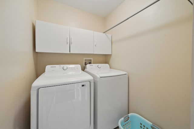 10582 Scott Dr, Huntley, IL 60142 - laundry area with washing machine and clothes dryer and cabinet space