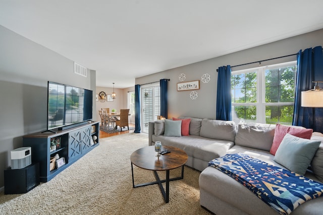 10582 Scott Dr, Huntley, IL 60142 - carpeted living room with a chandelier
