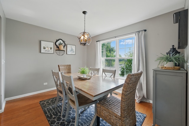 10582 Scott Dr, Huntley, IL 60142 - dining area with light wood finished floors and a chandelier