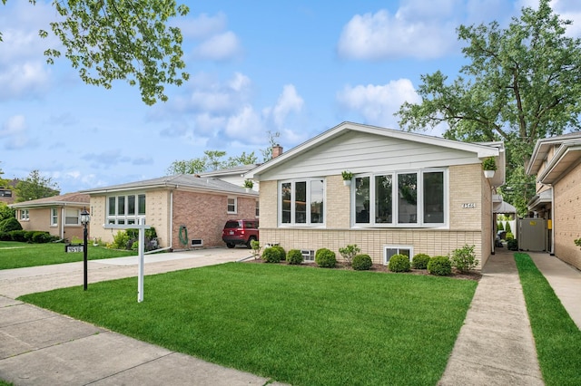 4546 Howard St, Skokie, IL 60076 - view of front of home featuring brick siding and a front lawn