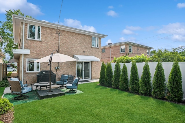 4546 Howard St, Skokie, IL 60076 - rear view of house with brick siding and a patio