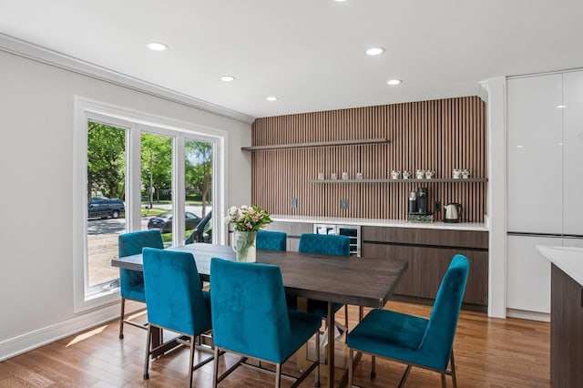 4546 Howard St, Skokie, IL 60076 - dining room with recessed lighting, wood finished floors, and ornamental molding
