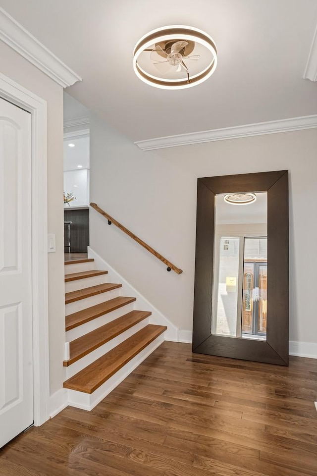 4546 Howard St, Skokie, IL 60076 - staircase with crown molding and wood finished floors