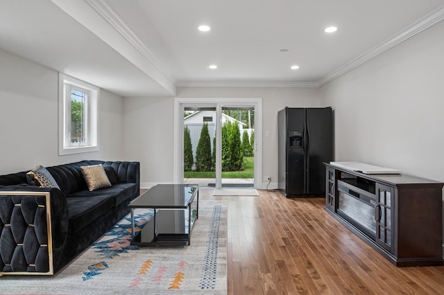4546 Howard St, Skokie, IL 60076 - living room with wood finished floors, ornamental molding, and recessed lighting