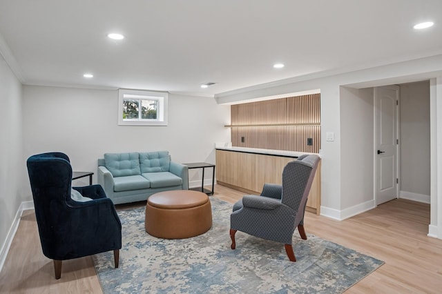 4546 Howard St, Skokie, IL 60076 - living area with light wood-style floors, crown molding, and recessed lighting