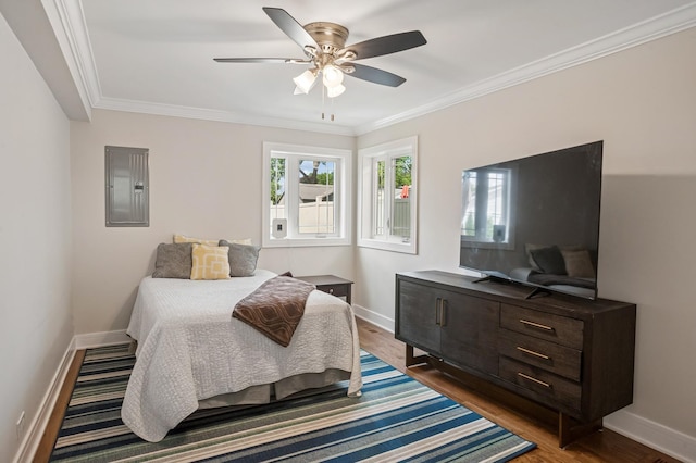 4546 Howard St, Skokie, IL 60076 - bedroom featuring electric panel, wood finished floors, ornamental molding, and ceiling fan