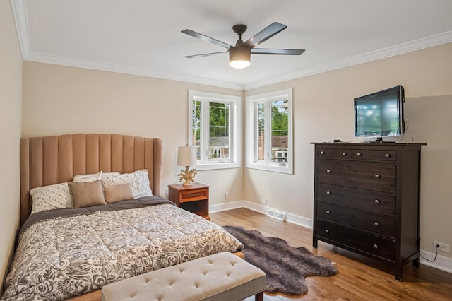 4546 Howard St, Skokie, IL 60076 - bedroom with wood finished floors, crown molding, and a ceiling fan