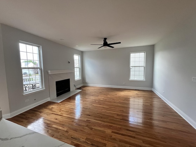 1266 Airs Ave, Sugar Grove, IL 60554 - unfurnished living room with wood finished floors, a premium fireplace, and a ceiling fan