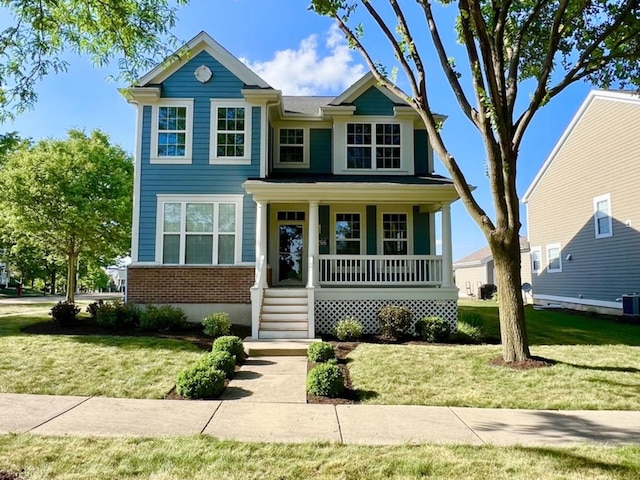 1266 Airs Ave, Sugar Grove, IL 60554 - view of front facade featuring a porch, a front yard, and brick siding