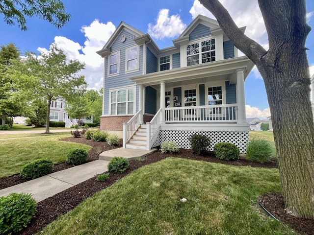 1266 Airs Ave, Sugar Grove, IL 60554 - traditional-style house featuring covered porch, a front lawn, and brick siding
