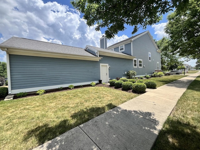 1266 Airs Ave, Sugar Grove, IL 60554 - view of property exterior featuring a yard and a chimney