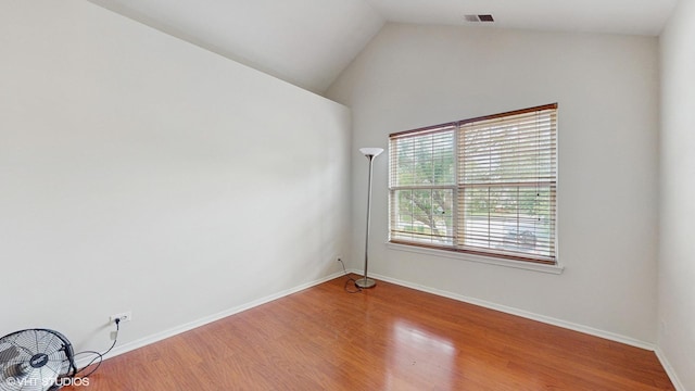 434 Cromwell Cir Unit 3, Bartlett, IL 60103 - empty room with wood finished floors and lofted ceiling