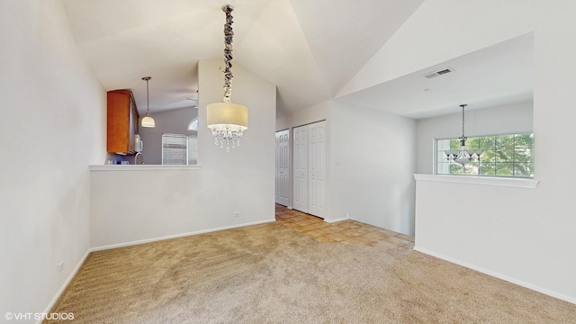 434 Cromwell Cir Unit 3, Bartlett, IL 60103 - carpeted spare room featuring a chandelier and lofted ceiling
