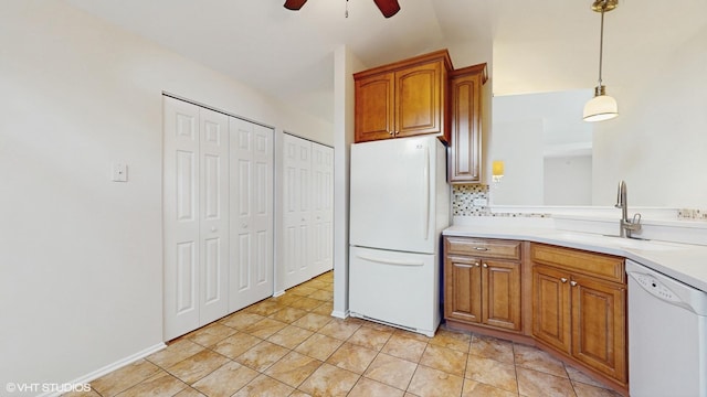 434 Cromwell Cir Unit 3, Bartlett, IL 60103 - kitchen with white appliances, a ceiling fan, brown cabinetry, light countertops, and vaulted ceiling