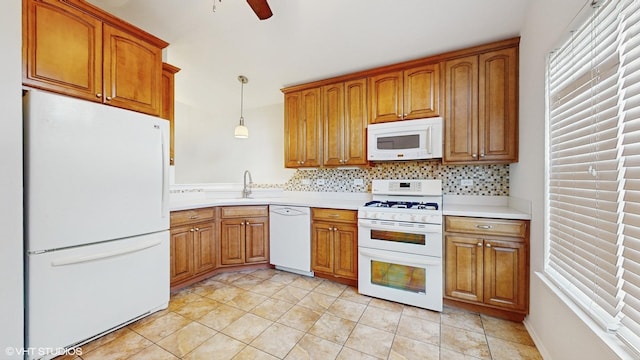 434 Cromwell Cir Unit 3, Bartlett, IL 60103 - kitchen featuring white appliances, brown cabinets, light countertops, backsplash, and ceiling fan