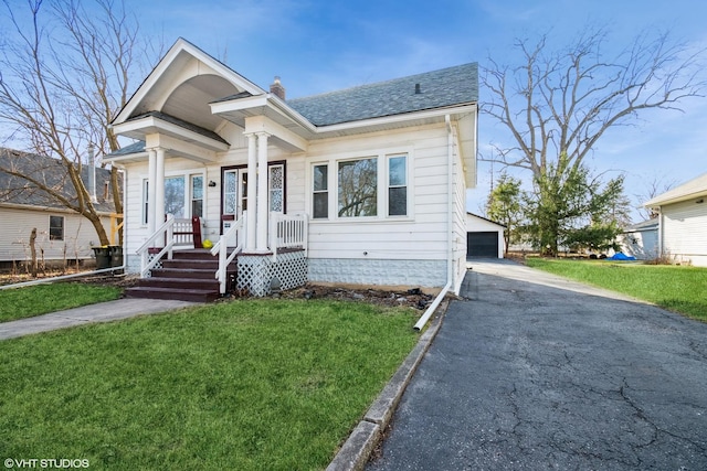 120 S Kinzie St, Thornton, IL 60476 - view of front of home with a chimney, an outdoor structure, a front yard, and a garage