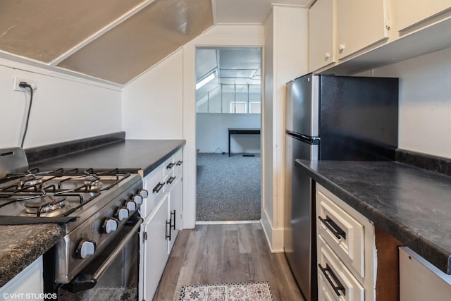 120 S Kinzie St, Thornton, IL 60476 - kitchen with appliances with stainless steel finishes, dark countertops, white cabinetry, and dark wood-type flooring