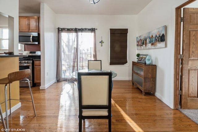 120 S Kinzie St, Thornton, IL 60476 - dining space featuring light wood-type flooring and baseboards