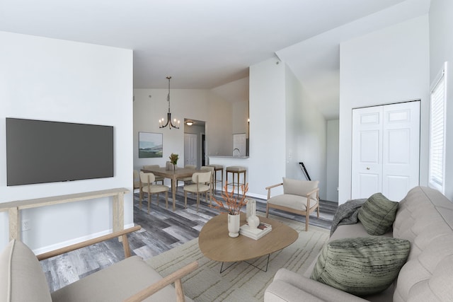 128 Bertram Dr Unit M, Yorkville, IL 60560 - living area featuring wood finished floors, a chandelier, and high vaulted ceiling
