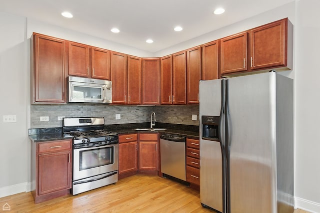 6200 S Evans Ave Unit 3, Chicago, IL 60637 - kitchen with stainless steel appliances, light wood-type flooring, decorative backsplash, and recessed lighting