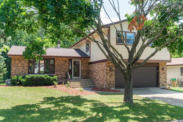 1707 Roosa Ln, Elk Grove Village, IL 60007 - tri-level home featuring brick siding, driveway, a garage, and a front yard