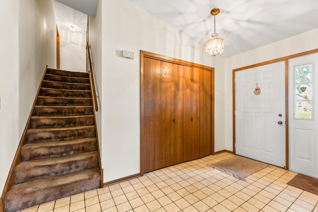 1707 Roosa Ln, Elk Grove Village, IL 60007 - foyer with stairs, a chandelier, and light tile patterned floors