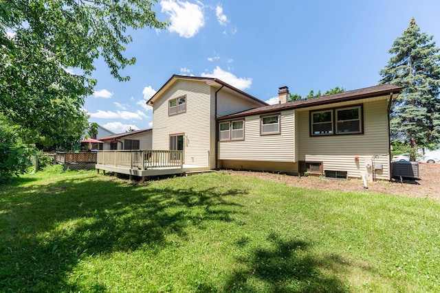 1707 Roosa Ln, Elk Grove Village, IL 60007 - rear view of property with a chimney, a deck, and a lawn