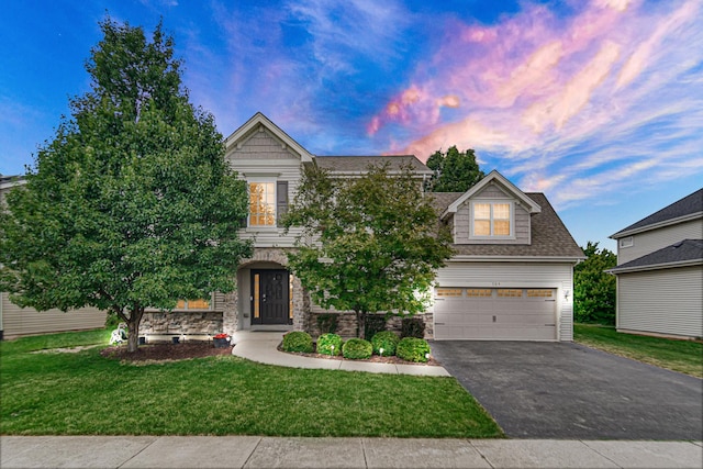 504 W Hillcrest Dr, Romeoville, IL 60446 - view of front facade featuring asphalt driveway, stone siding, a front lawn, an attached garage, and roof with shingles