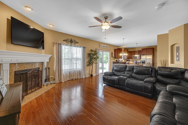 504 W Hillcrest Dr, Romeoville, IL 60446 - living area with ceiling fan, hardwood / wood-style floors, and a fireplace