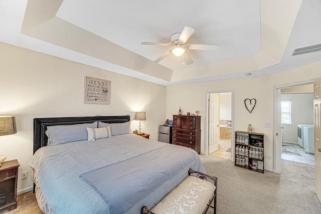 504 W Hillcrest Dr, Romeoville, IL 60446 - bedroom with a raised ceiling, light colored carpet, ceiling fan, and ensuite bathroom