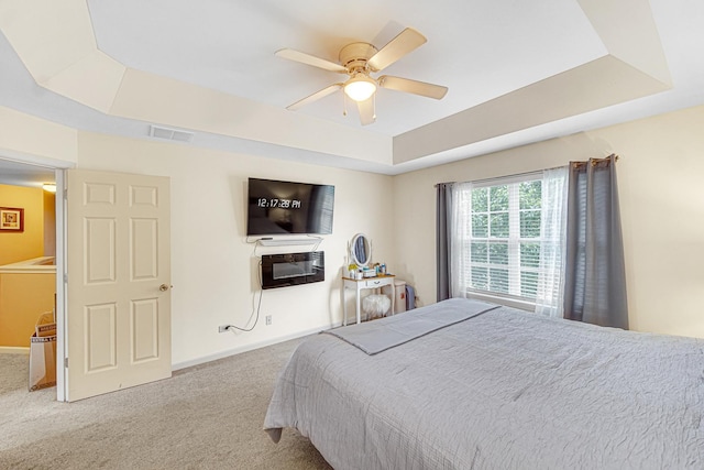 504 W Hillcrest Dr, Romeoville, IL 60446 - bedroom featuring a raised ceiling, carpet floors, and a ceiling fan