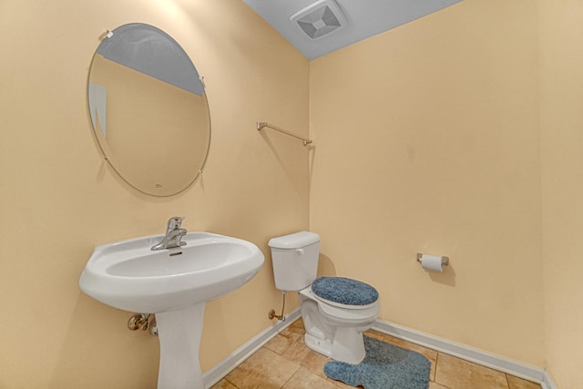 504 W Hillcrest Dr, Romeoville, IL 60446 - half bathroom with toilet and tile patterned flooring