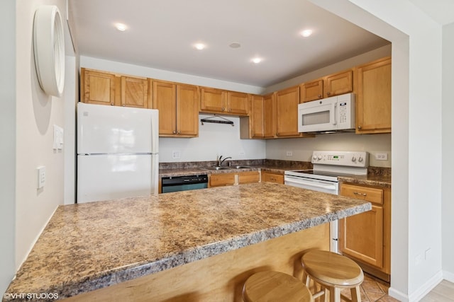 910 Beau Dr Unit 211, Des Plaines, IL 60016 - kitchen featuring white appliances, a breakfast bar area, and recessed lighting