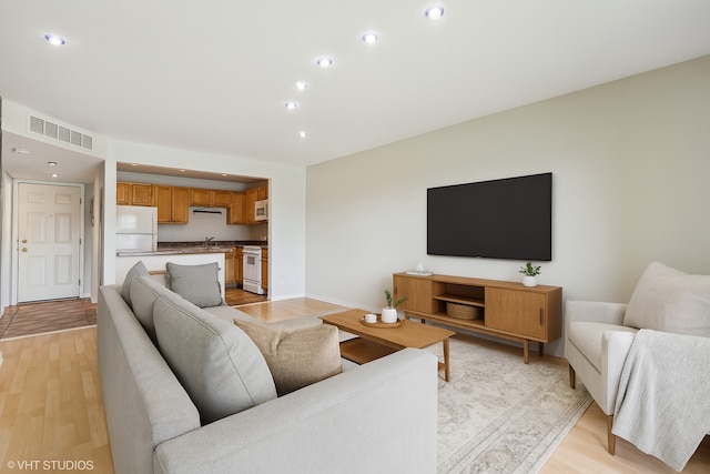 910 Beau Dr Unit 211, Des Plaines, IL 60016 - living area featuring light wood-style floors and recessed lighting