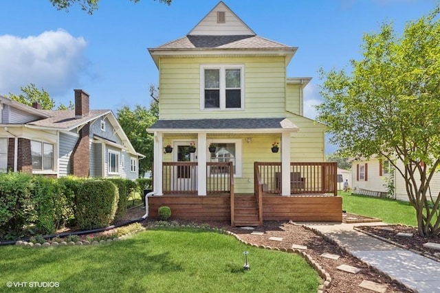 1108 Oakland Ave, Joliet, IL 60435 - view of front of property with covered porch, a front yard, and a shingled roof